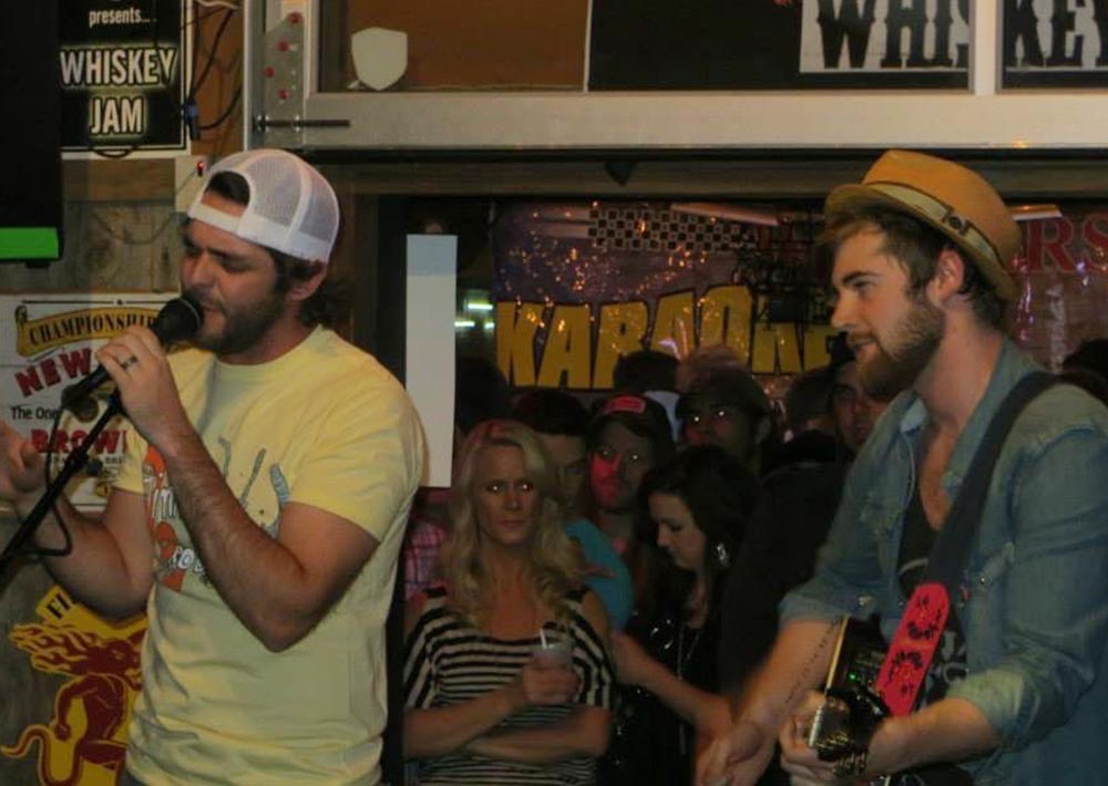 Jimmy Robbins performing with Thomas Rhett