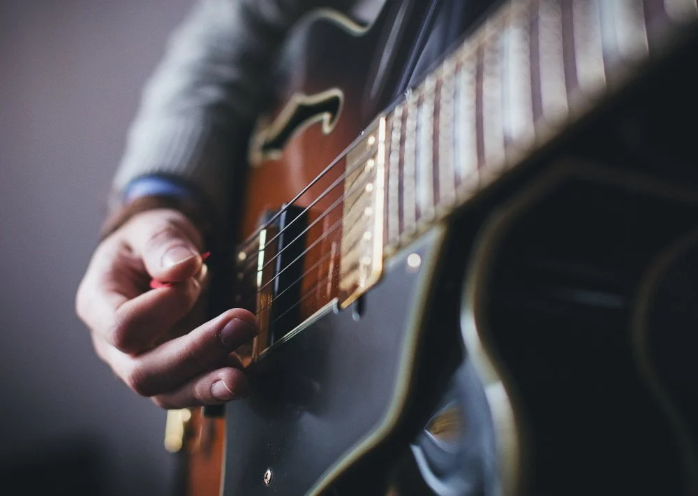 playing electric guitar